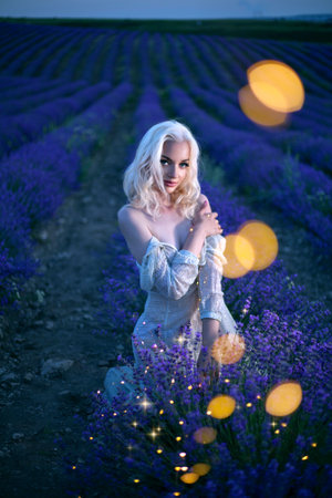 Beautiful healthy hair. Young girl brunette with long shiny hair over lavender field. Care and...
