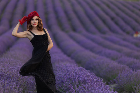 Beautiful girl is wearing fashion dress at field of lavender. Provenceの写真素材