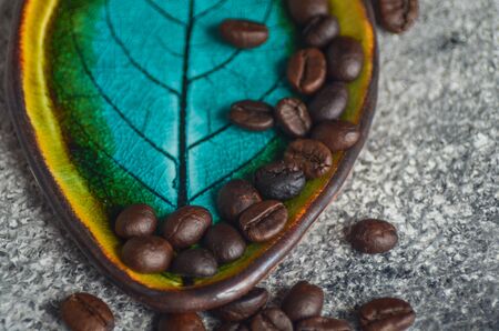 Coffee time concept with fresh beans on stone background with copy spaceの写真素材