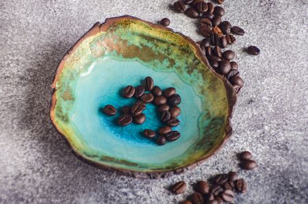Coffee time concept with fresh beans on stone background with copy spaceの写真素材