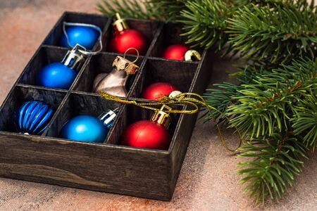 Christmas gift concept with bright ribbon and fir tree on wooden background with copy spaceの写真素材