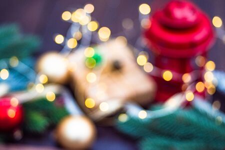 Christmas gift concept with bright ribbon and fir tree on wooden background with copy spaceの写真素材