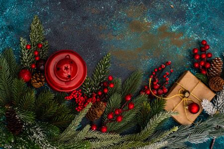 Christmas gift concept with bright ribbon and fir tree on wooden background with copy spaceの写真素材