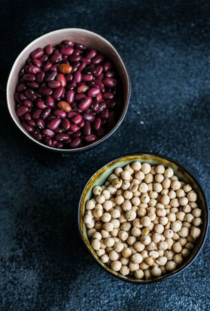 Cooking concept with bowls full of organic beans and chickpeasの写真素材