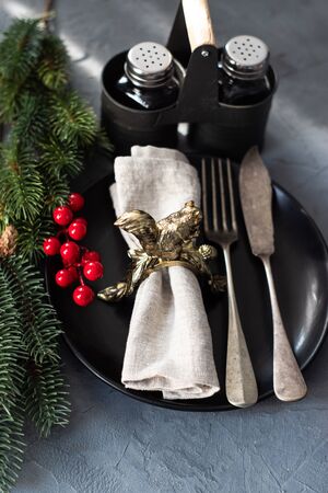 Christmas card concept festive table setting on stone background with copy spaceの写真素材