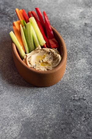 hummus vegetarian dish on Rustic background with copy space