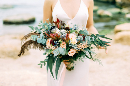 Wedding bouquet in hands of the brideの写真素材