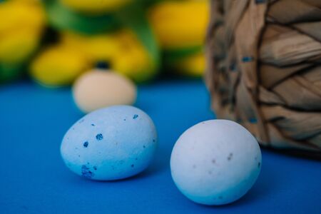 Happy Easter. Easter holiday decorations on trendy colored classic blue background. Creative spring...