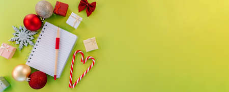 Christmas wishlist banner. Christmas composition. Present box, firtree branches, Xmas candy canes,...