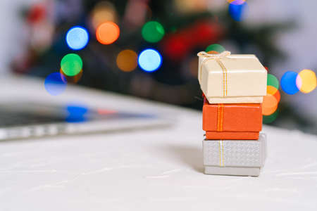 Christmas online shopping. Woman buy presents, prepare to xmas, among shopping cart and presents...