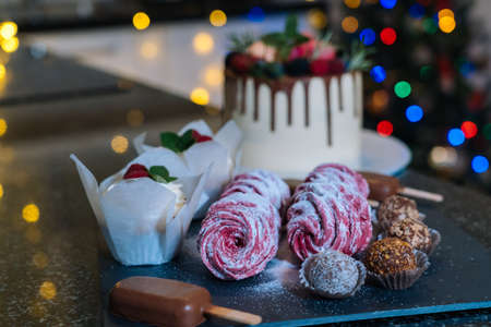 Homemade Christmas baked assorted sweets. Happy New Year and Merry Christmas background. Winter...