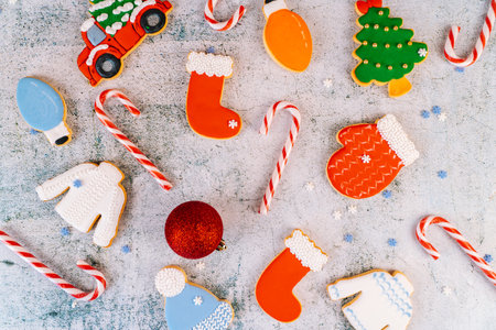 Christmas and new year gingerbread cookies on table. sweets tasty biscuits glazed sugar icing decoration. Winter holidays, New Year eve party or xmas concept. Seasonal packaging and attributes.の写真素材