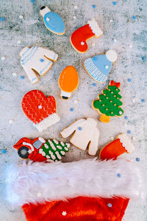 Christmas and new year gingerbread cookies on table. sweets tasty biscuits glazed sugar icing decoration. Winter holidays, New Year eve party or xmas concept. Seasonal packaging and attributes.の写真素材