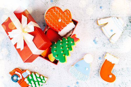 Christmas and new year gingerbread cookies on table. sweets tasty biscuits glazed sugar icing decoration. Winter holidays, New Year eve party or xmas concept. Seasonal packaging and attributes.の写真素材