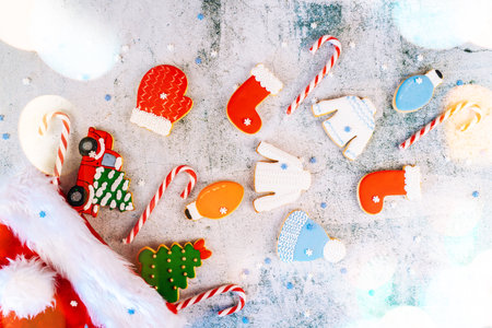 Christmas and new year gingerbread cookies on table. sweets tasty biscuits glazed sugar icing decoration. Winter holidays, New Year eve party or xmas concept. Seasonal packaging and attributes.の写真素材