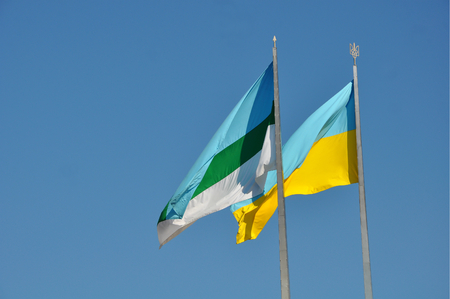 Ukraine national and Rivne municipal flags flatteringの写真素材