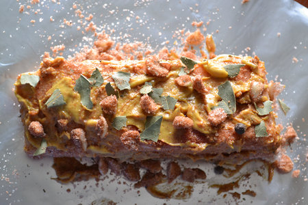 Marinated in the spicy mustard peace of fresh pork meat, with salt, pepper, chopped garlic and bay leaf on the sheet of foil, top view, ready-to-bakeの写真素材