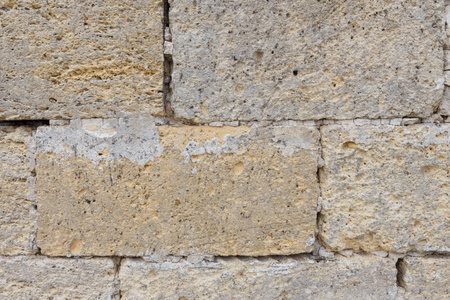 Dirty uneven brickwall texture background or backdrop with stains and cement smears