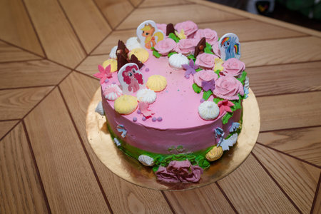 Izmail, Ukraine - October 2019. Editorial use. Birthday girlish cake with pony illustrations....