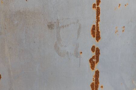 Rusty wall texture with peeling off paint remains. Background or backdrop.の写真素材