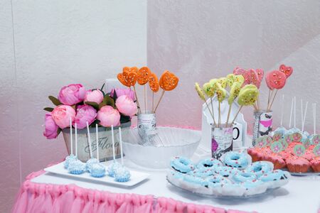Izmail, Ukraine - August 2017. Editorial use. Candy bar with muffins, donuts and cake pops for girl birthday party. の写真素材