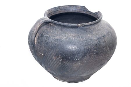 old vintage ancient broken scratched ceramic dark vase or pot on white backgroundの写真素材