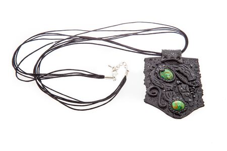 Necklace with polymer clay pendant  isolated on white background. Female accessories, decorative ornaments and jewelry. Fashion and style concept.の写真素材