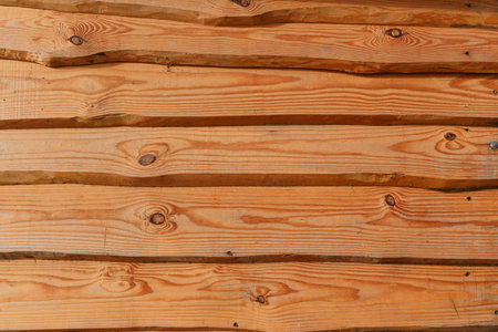 Brown wooden boards or fence texture background or backdrop with old paintの写真素材