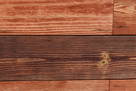Brown wooden boards or fence texture background or backdrop with old paintの写真素材