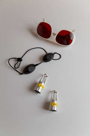 Soft focused shot of protective glasses for laser tattoo removal, medical equipment. Skin care, health and beauty concept.の写真素材