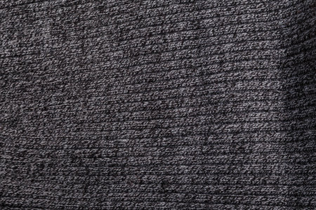 Melange gray, black and white knit fabric texture, background or backdrop.