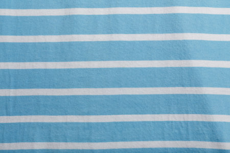 Texture of blue and white striped cotton wrinkled fabric, background or backdrop. Clothing, sewing, gressmaking, haberdashery. Copy space.の写真素材