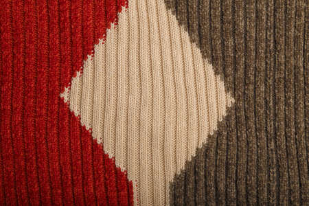 Knit brown and gray fabric texture, background or backdrop. Textile, scarf or sweater textured surface. Warm accessories, clothing, fashion concept.の写真素材