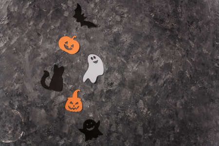 Happy Halloween stickers set on gray background. Black cat, scary pumpkin, evil ghost, flying bat. Halloween decorations. Frame card, copy space.の写真素材