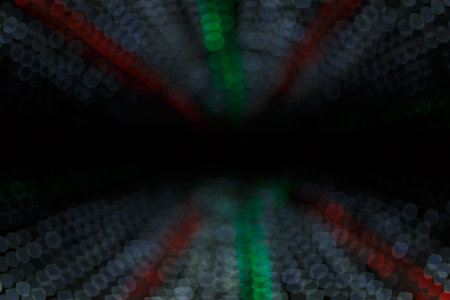 Unfocused night shot of Christmas garland lights bokeh in the city. Happy New Year, Merry Christmas, winter holidays concept.の写真素材