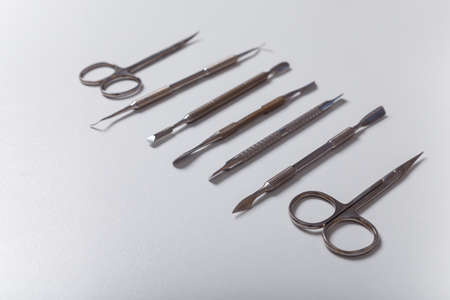 Manicure, pedicure equipment set on white background. Disinfected instruments for safe hygiene, beauty and hands care. Copy spaceの写真素材