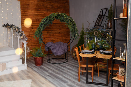 Rustic style Christmas festive decorations, fireplace with firewood, table, chairs, circle sitting...