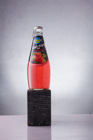 Izmail, Ukraine. June 2021. Freshness boom Basil seed drink with strawberry flavor. Bottle of sweet juice on white background.のeditorial素材