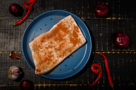 Ukrainian marinaded lard, sprinkled with red hot pepper and paprika seasonings. Onions, garlic,...