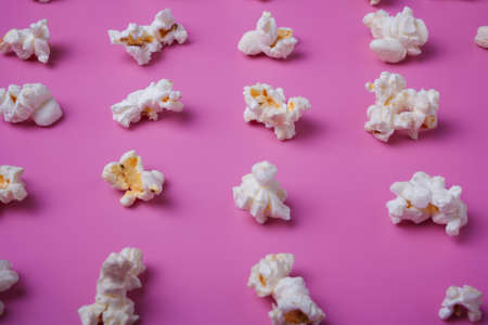Popcorn lay out on pink background, close up shotの写真素材