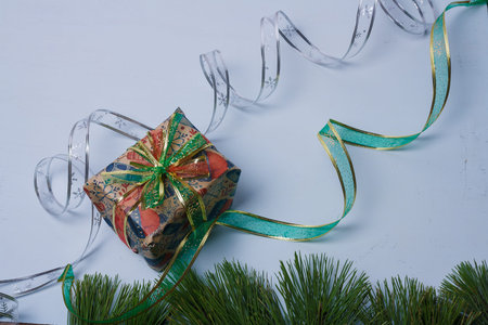 Merry Christmas and Happy New Year card, template, present box wrapped in kraft paper, silver...
