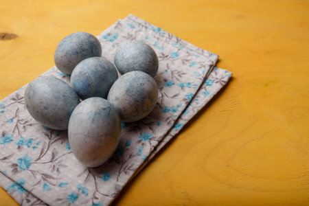 Easter in Ukraine 2022. Ukrainian flag colors: blue painted Easter eggs on yellow background. Copy spaceの写真素材