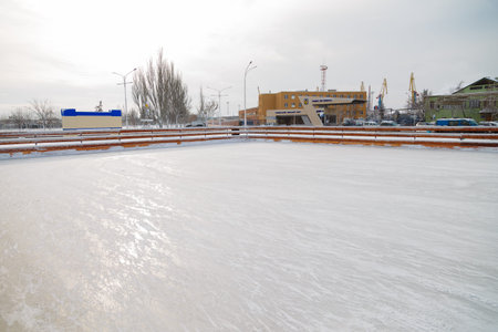 Izmail, Ukraine. February 2022. Empty skating ice rink outdoors, city leisure. No people, curfew. War in Ukaine, Russian military invasionのeditorial素材