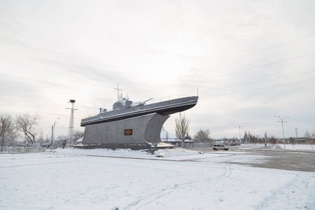 Izmail, Ukraine. February 2022. Navy war ship monument on the city street covered with snow. winter landscapeのeditorial素材