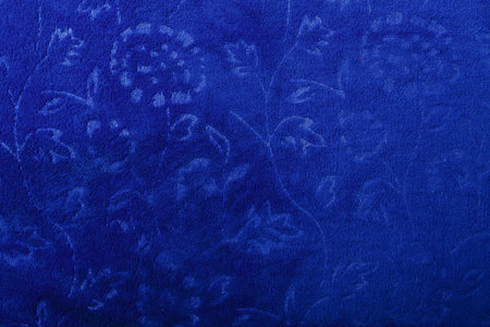 Microfibra dark blue towel fabric texture with floral pattern, background or backdrop.