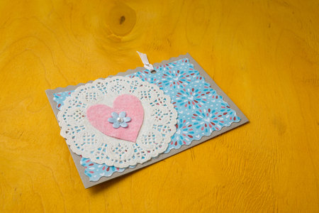 14 February Valentines day blue postcard with pink heart on bright yellow background