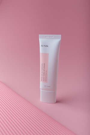 Izmail, Ukraine. March 2022. IUNIK Rose Galactomyces silky tone-up cream. Brightening and wrinkle care. Face skin Korean cosmeticsのeditorial素材
