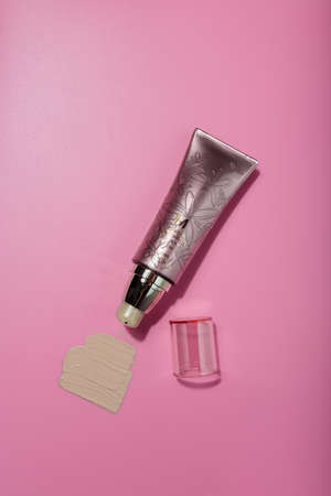 Izmail, Ukraine. March 2022. MISSHA SPF 25 BB Cream tube on pink background. Face skin care cosmetics, make up smeared sampleのeditorial素材