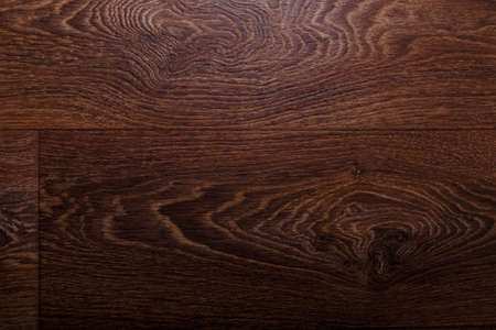 Brown linoleum with wooden textured surface, background backdrop texture. Floor changing, interior designの写真素材