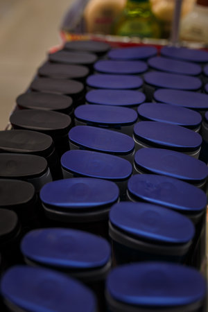 soft focused close up shot of tops of shampoo bottles in household chemicals department of a supermarket, store, shop.の写真素材